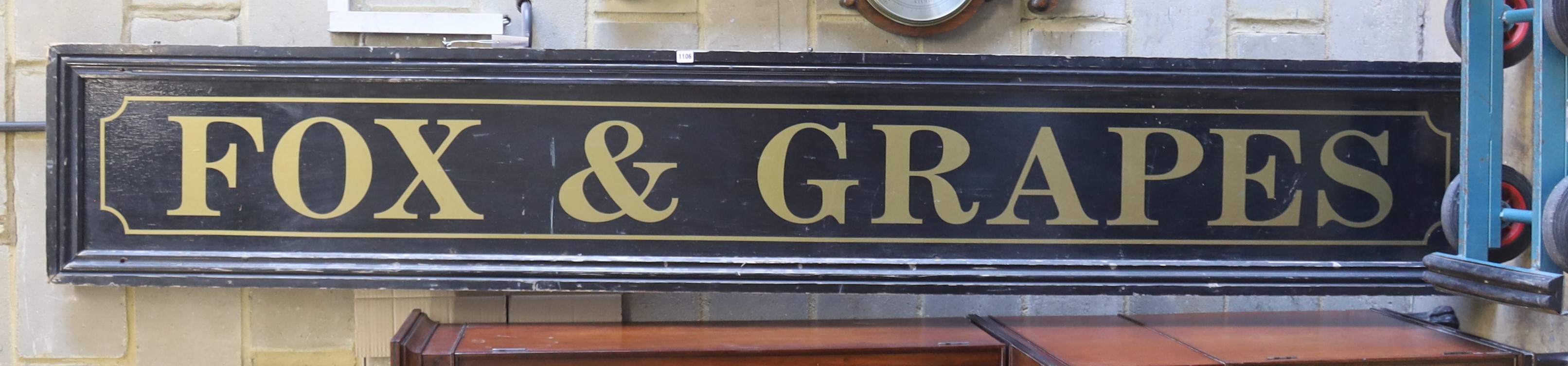 A large rectangular pub sign 'Fox and Grapes', length 290cm